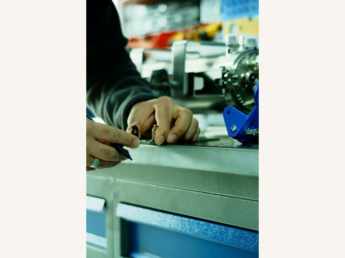 Worker examining a manufactured component