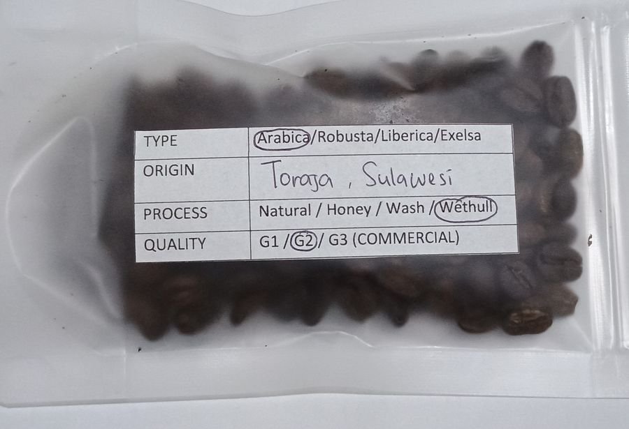 February 2026 Toraja Sulawesi coffee sample with handwritten specification label