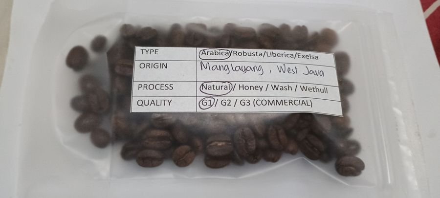 February 2026 Toraja Sulawesi coffee sample with process and grade label
