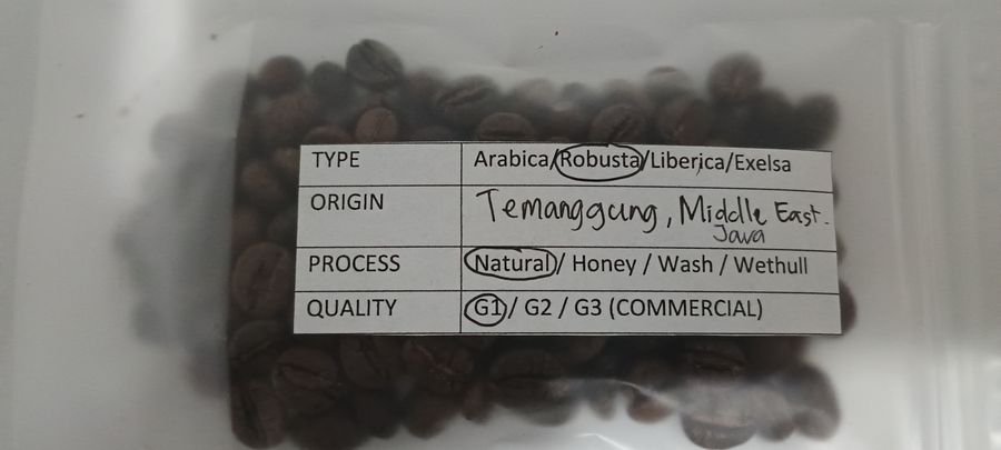 Labelled Toraja Sulawesi coffee sample photographed in February 2026