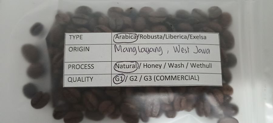 Indonesian coffee sample packet photographed for buyer review in February 2026